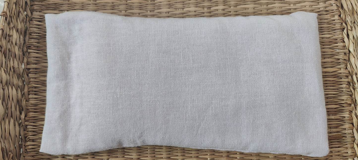 Lilac eye pillow on a woven surface
